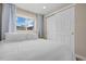 Inviting bedroom with a cozy bed, natural light, and closet space for clothing and storage at 18866 W 59Th Pl, Golden, CO 80403
