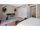 Bedroom featuring a functional workspace area and closet at 18866 W 59Th Pl, Golden, CO 80403