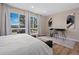 Bright bedroom featuring large windows, a dedicated workspace, and natural light at 18866 W 59Th Pl, Golden, CO 80403