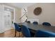 Open-concept dining area with dining table, a view of the stairs, and access to a modern bathroom at 18866 W 59Th Pl, Golden, CO 80403