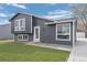 Charming two-story home with a well-manicured lawn, gray siding and white trim at 18866 W 59Th Pl, Golden, CO 80403