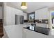 Spacious kitchen featuring sleek stainless steel appliances, ample counter space, and modern cabinetry at 18866 W 59Th Pl, Golden, CO 80403