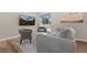 Comfortable living room with stylish furniture and mountain art on the wall at 18866 W 59Th Pl, Golden, CO 80403