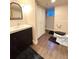 Basement bathroom with toilet, sink, and shower at 1469 S Andes Way, Aurora, CO 80017