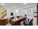 Spacious basement featuring a large desk, tv, staircase, carpeted floors, and neutral paint at 2608 E Fremont Pl, Centennial, CO 80122