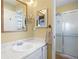 Bathroom with a marble countertop sink and walk-in shower at 2608 E Fremont Pl, Centennial, CO 80122