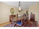 Elegant dining room featuring wooden furniture and a stylish mirror at 2608 E Fremont Pl, Centennial, CO 80122