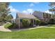 Comfortable home featuring a covered porch and verdant lawn at 2608 E Fremont Pl, Centennial, CO 80122