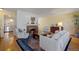 Bright living room featuring a cozy fireplace and comfortable seating at 2608 E Fremont Pl, Centennial, CO 80122