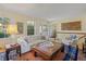 Spacious living room with large windows providing ample natural light at 2608 E Fremont Pl, Centennial, CO 80122