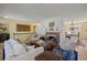 Bright living room with a traditional brick fireplace and open layout at 2608 E Fremont Pl, Centennial, CO 80122