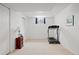 Basement workout room featuring carpeted floors, neutral paint, and a treadmill at 2608 E Fremont Pl, Centennial, CO 80122