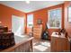 Cozy bedroom with an exercise bike, dresser, natural light from the windows, and closet at 19795 W 57Th Ave, Golden, CO 80403
