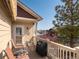 Relaxing outdoor deck area with seating, grill, and views of the surrounding neighborhood at 19795 W 57Th Ave, Golden, CO 80403