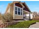 Charming exterior view of the house featuring well-manicured landscaping and inviting entrance at 19795 W 57Th Ave, Golden, CO 80403
