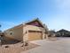 Attached two-car garage and convenient driveway with meticulously maintained landscaping at 19795 W 57Th Ave, Golden, CO 80403