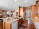 Modern kitchen with granite countertops, wood cabinets, and stainless steel appliances at 19795 W 57Th Ave, Golden, CO 80403