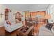 Open-concept living space with hardwood floors, dining area, and a seamless flow to the kitchen at 19795 W 57Th Ave, Golden, CO 80403