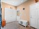 Functional mudroom with built-in bench seating, storage, and multiple doorways at 19795 W 57Th Ave, Golden, CO 80403