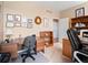 Bright home office with a large desk, built-in bookshelves, and natural light at 19795 W 57Th Ave, Golden, CO 80403