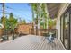 Outdoor deck features metal railings, blue patio furniture and shade trees at 853 Saint Paul St, Denver, CO 80206
