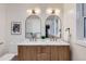 Elegant bathroom showcasing double vanity, stylish mirrors, and modern fixtures at 853 Saint Paul St, Denver, CO 80206