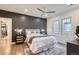 Beautiful bedroom featuring a ceiling fan, hardwood floors, and a modern accent wall at 853 Saint Paul St, Denver, CO 80206