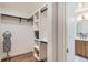 Neat closet with custom shelves and black hanging bar, providing plenty of space at 853 Saint Paul St, Denver, CO 80206