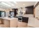 Stylish kitchen boasts stainless steel appliances, quartz countertops, and a skylight at 853 Saint Paul St, Denver, CO 80206