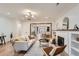 Spacious living room with a fireplace, hardwood floors, and a view of the open kitchen at 853 Saint Paul St, Denver, CO 80206