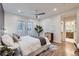 Inviting primary bedroom featuring hardwood floors, ensuite bathroom, and large windows at 853 Saint Paul St, Denver, CO 80206