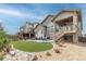 Beautiful backyard featuring a patio, deck, lawn, and landscaping, offering a perfect space for relaxation and outdoor enjoyment at 11890 Discovery Cir, Parker, CO 80138