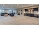 Finished basement with a wet bar, recreational space, and ample room for entertainment at 11890 Discovery Cir, Parker, CO 80138