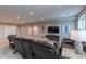 Finished basement living area featuring recessed lighting, wall-mounted TV, and comfortable reclining furniture at 11890 Discovery Cir, Parker, CO 80138