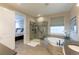 Luxurious bathroom features a glass shower, soaking tub, and neutral color palette at 11890 Discovery Cir, Parker, CO 80138