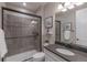 Stylish bathroom with gray tiled shower and a modern vanity, providing an elegant design at 11890 Discovery Cir, Parker, CO 80138