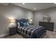 Bedroom featuring soft lighting, carpeting, and gray dresser for a serene and calming atmosphere at 11890 Discovery Cir, Parker, CO 80138