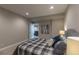 Bedroom featuring soft lighting, carpeting, and access to adjoining room at 11890 Discovery Cir, Parker, CO 80138