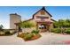 Exterior of a community building with a silo and beautiful landscaping at 11890 Discovery Cir, Parker, CO 80138