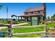 Exterior shot of the inviting Fika Coffee House with a charming porch and well-maintained landscaping at 11890 Discovery Cir, Parker, CO 80138