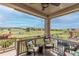 Relaxing covered deck offering comfortable seating and scenic views of the open landscape, ideal for outdoor enjoyment at 11890 Discovery Cir, Parker, CO 80138
