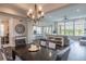 Elegant dining room with views into the kitchen and the living room, creating a great flow for entertaining at 11890 Discovery Cir, Parker, CO 80138