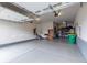 Spacious three car garage with epoxy floors, overhead lighting, and plenty of storage space at 11890 Discovery Cir, Parker, CO 80138