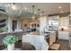 Open-concept kitchen featuring an island with granite countertops and stainless steel appliances, perfect for entertaining at 11890 Discovery Cir, Parker, CO 80138