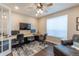 Spacious home office with two workstations, dark wood floors, and a comfortable leather chair at 11890 Discovery Cir, Parker, CO 80138