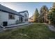 Backyard with mature trees, nice deck area and a storage shed at 4530 Ridgewood Ct, Castle Rock, CO 80109