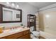 Simple bathroom with a vanity sink, toilet, and shower-tub combo at 4530 Ridgewood Ct, Castle Rock, CO 80109