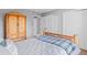 Bright bedroom featuring rustic wood furnishings and light gray colored walls at 4530 Ridgewood Ct, Castle Rock, CO 80109