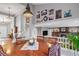 View of dining area leading to the living room with a fireplace and stair access at 4530 Ridgewood Ct, Castle Rock, CO 80109