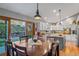 Dining area with an exposed kitchen and sliding glass door to the exterior yard at 4530 Ridgewood Ct, Castle Rock, CO 80109